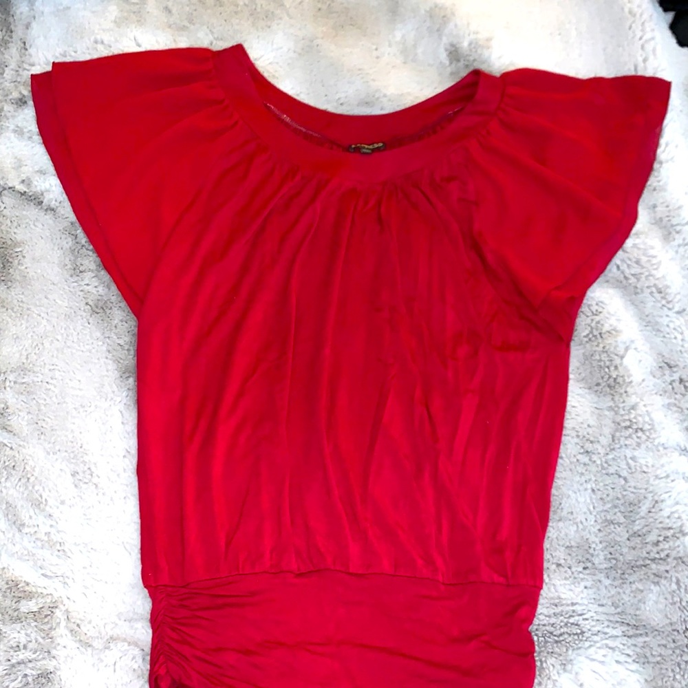 Red blouse with a singed waste